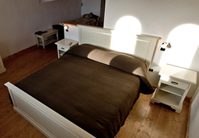 Bedroom with queen-size bed. Locanda Incantata B&B